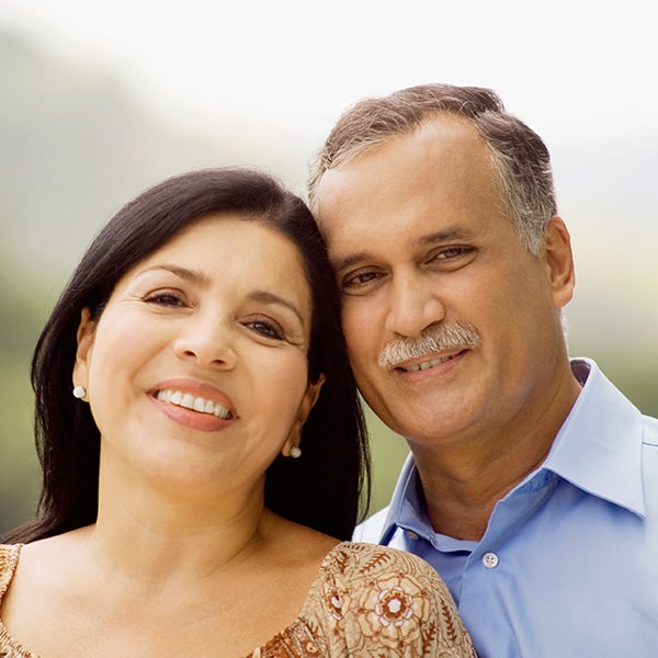 A mature latin couple smiling